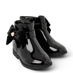 Patent leather booties with removable bow